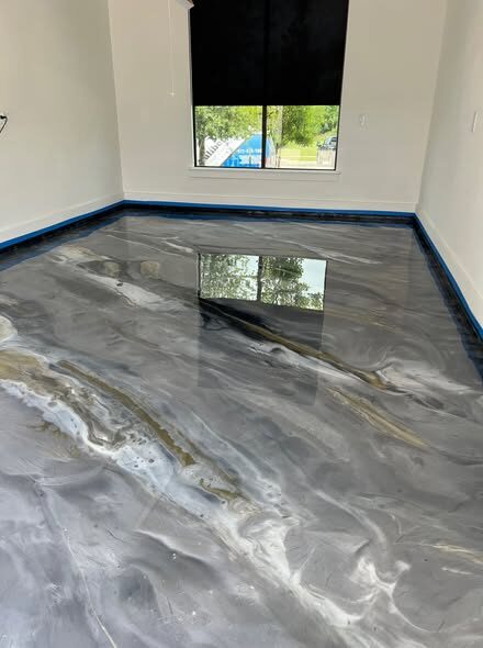 Metallic epoxy floor finish in gray and gold